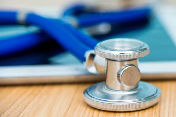 Close up on digital tablet and stethoscope